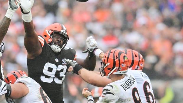 Sep 10, 2023; Cleveland, Ohio, USA; Cincinnati Bengals quarterback Joe Burrow (9) passes over the defense of Cleveland Browns defensive tackle Shelby Harris (93) during the second half at Cleveland Browns Stadium. Mandatory Credit: Ken Blaze-USA TODAY Sports  